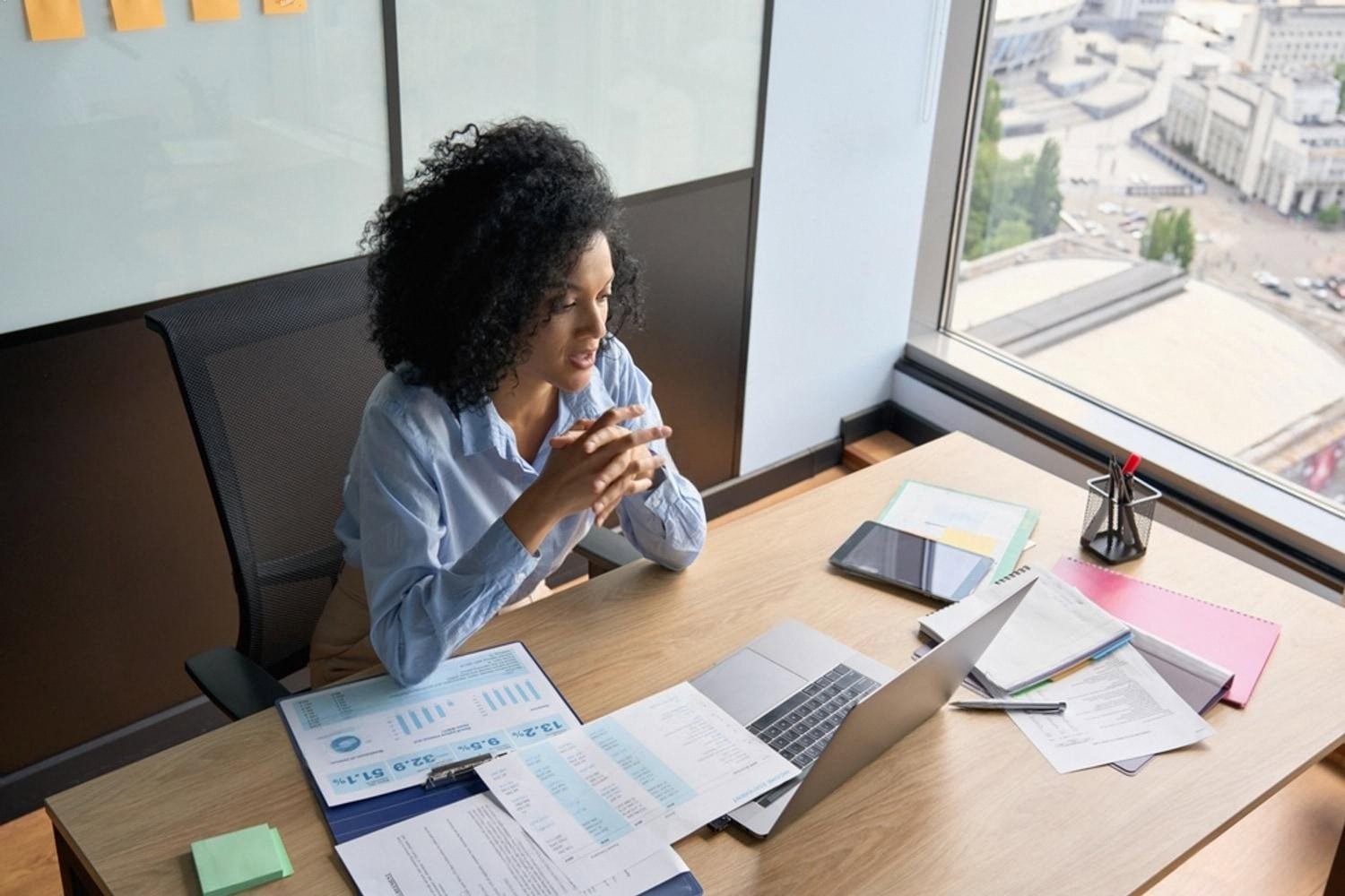 Finance professional reviewing charts and reports in a UAE office